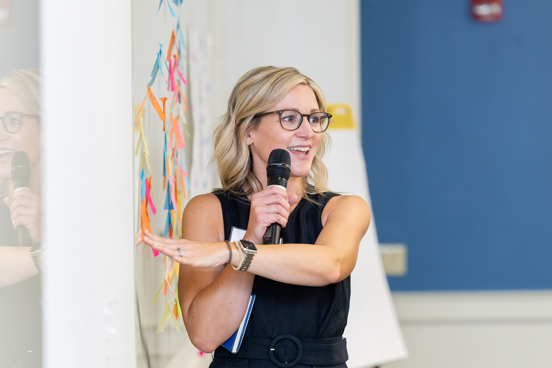 Woman presenting at board