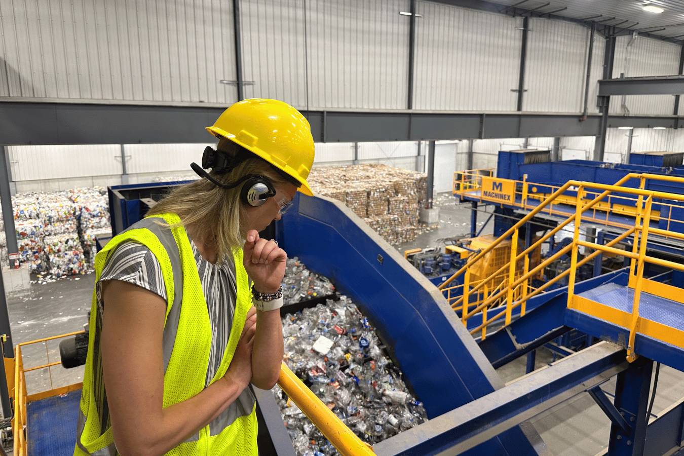 woman in ppe overlooking waste facility